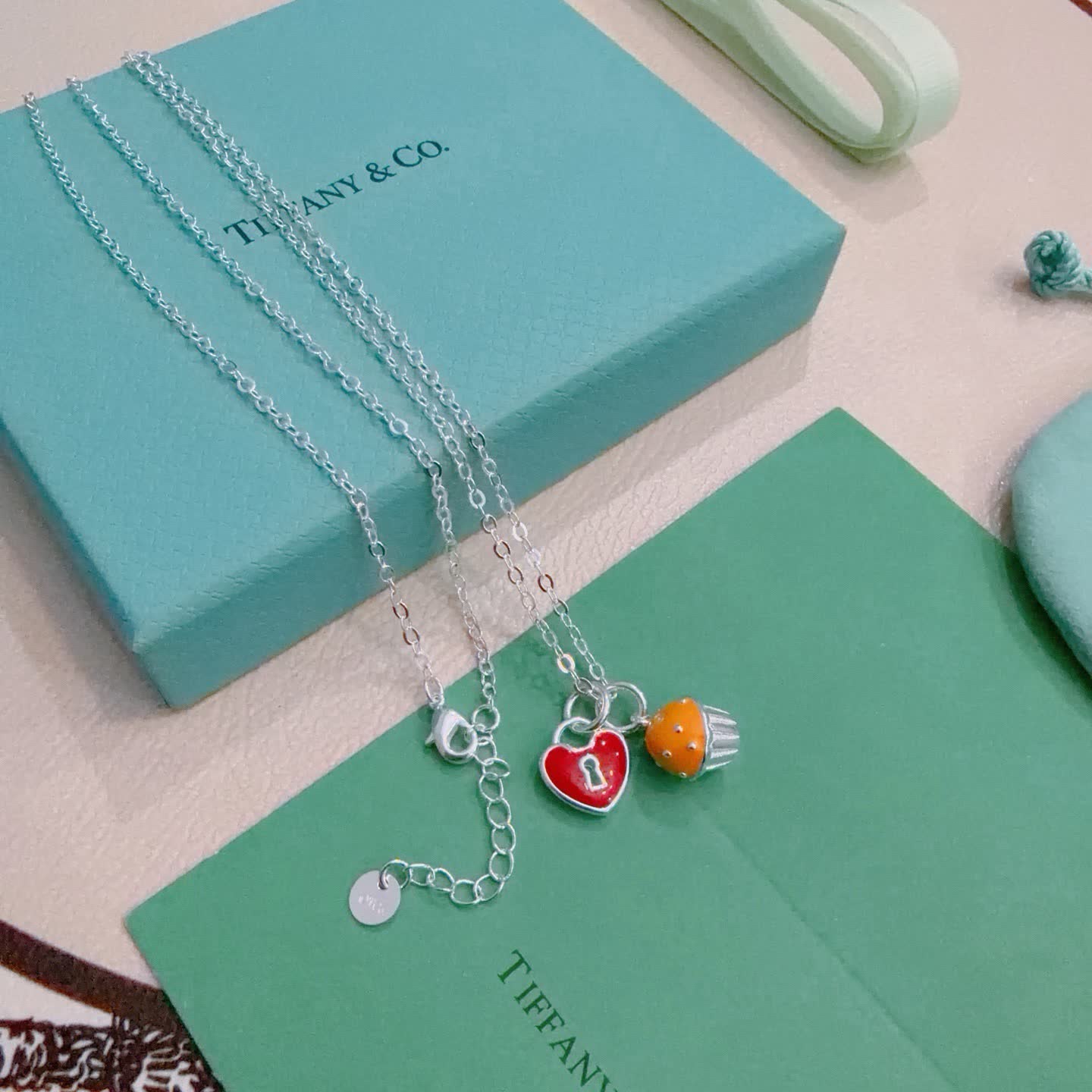 Tiffany & Co. Lock and Key Necklace with Cupcake Charm Tiffany & Co. Lock and Key Necklace with Cupcake Charm